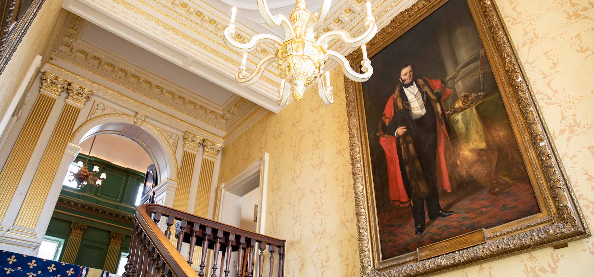 A view of the Railway King portrait which hangs in a stairwell in the Mansion House.