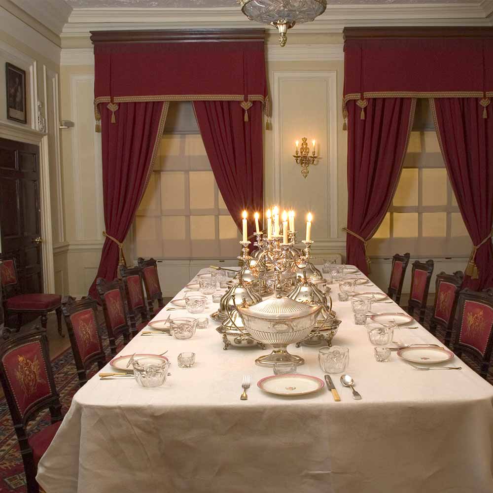 A formal dining table set for dinner.